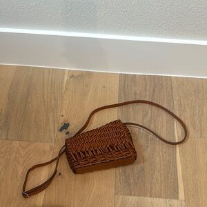 STAUD Brown Woven Leather Crossbody Bag with Flap Closure